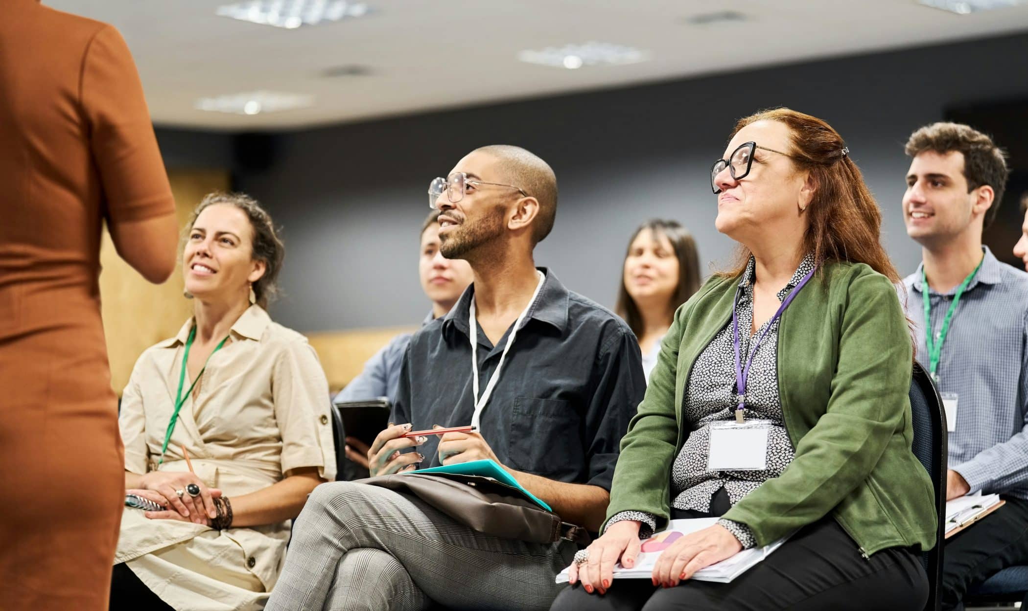 Group of businesspeople listening to a speaker during a conference event